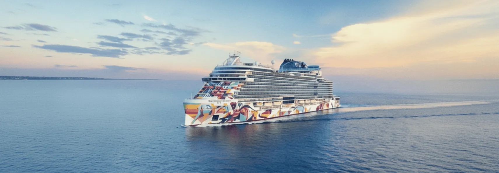 The Essential Cruise Shop's expert guide to Norwegian Cruise Line, featuring one of their signature cruise ships.