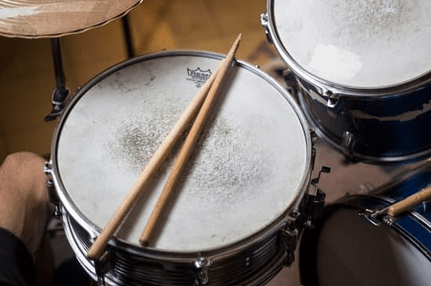 The Evolution of Drumming Styles Across Decades: 