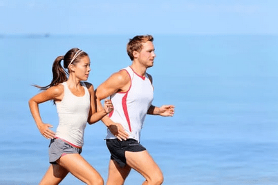 couple beach running