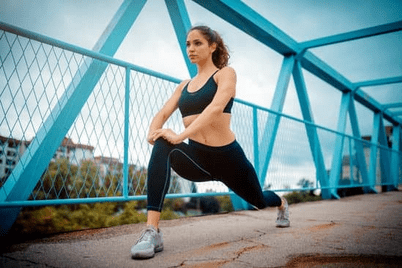 girl warming up for run