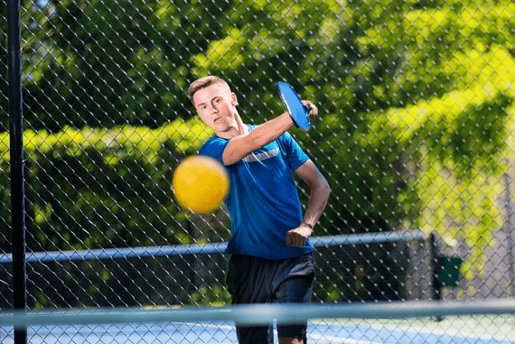 man relaying ball