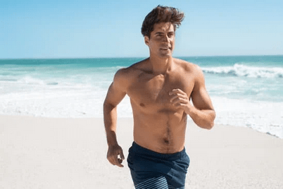 guy running on beach