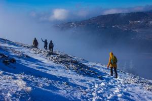 Stay safe and warm while exploring the outdoors with these must-have gear items and valuable tips for hiking in winter