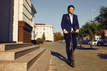 man on scooter