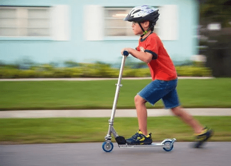 kid on scooter