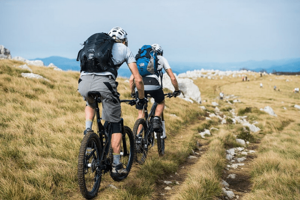 couple riding electric bikes