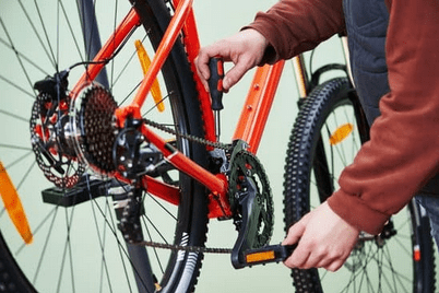 man working on bike