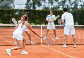 begginers playing tennis