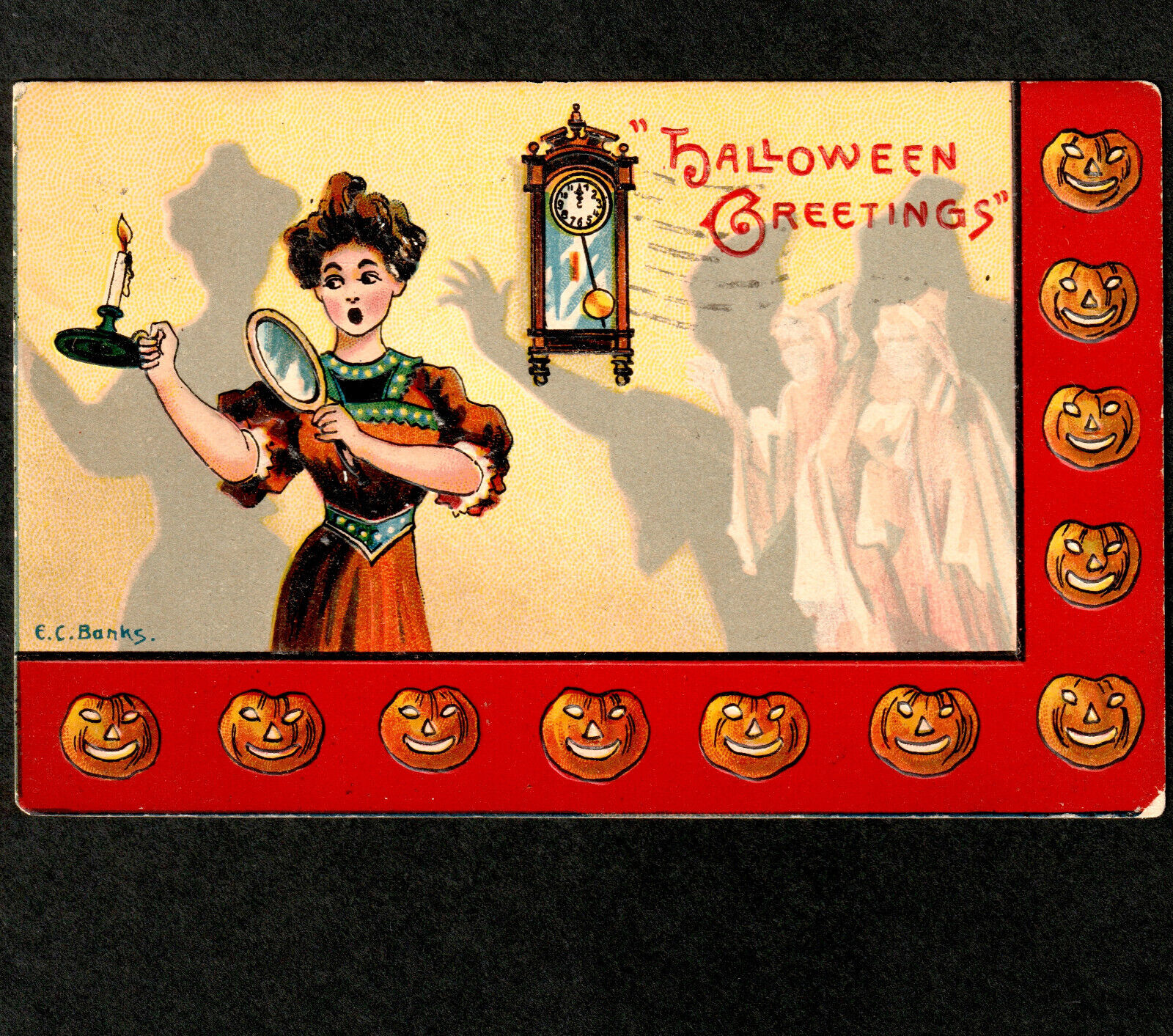 Vintage Halloween postcard with ghost, mirror, and lady