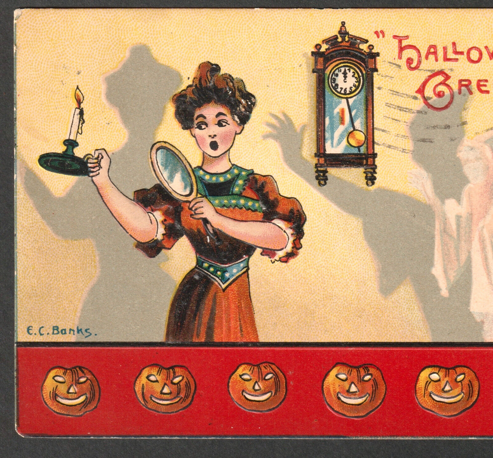 Vintage Halloween postcard with ghost, mirror, and lady