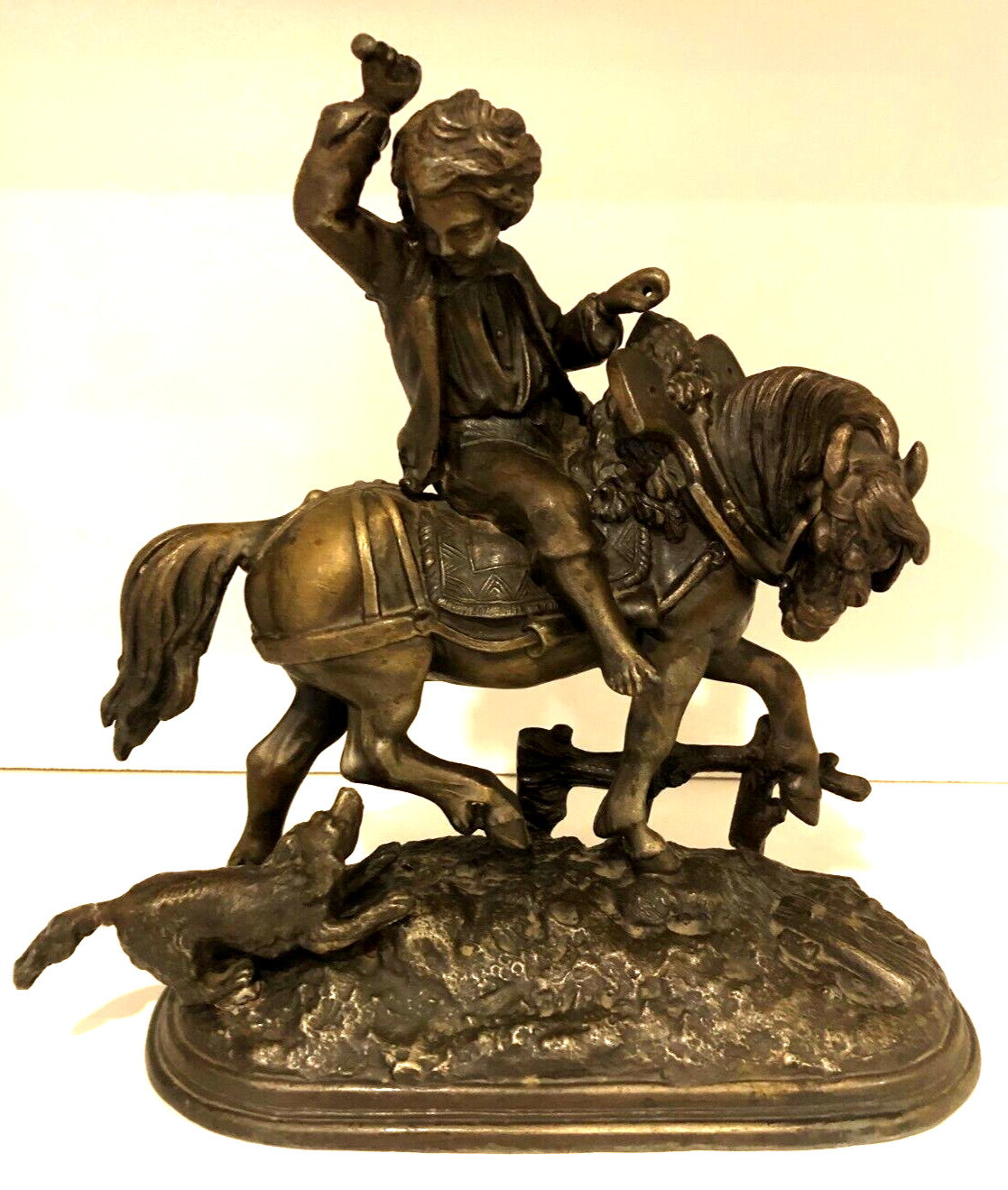 Vintage metal sculpture of Boy on Horse with Dog