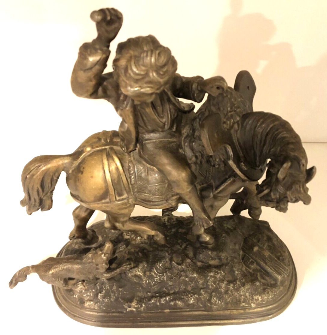 Vintage metal sculpture of Boy on Horse with Dog