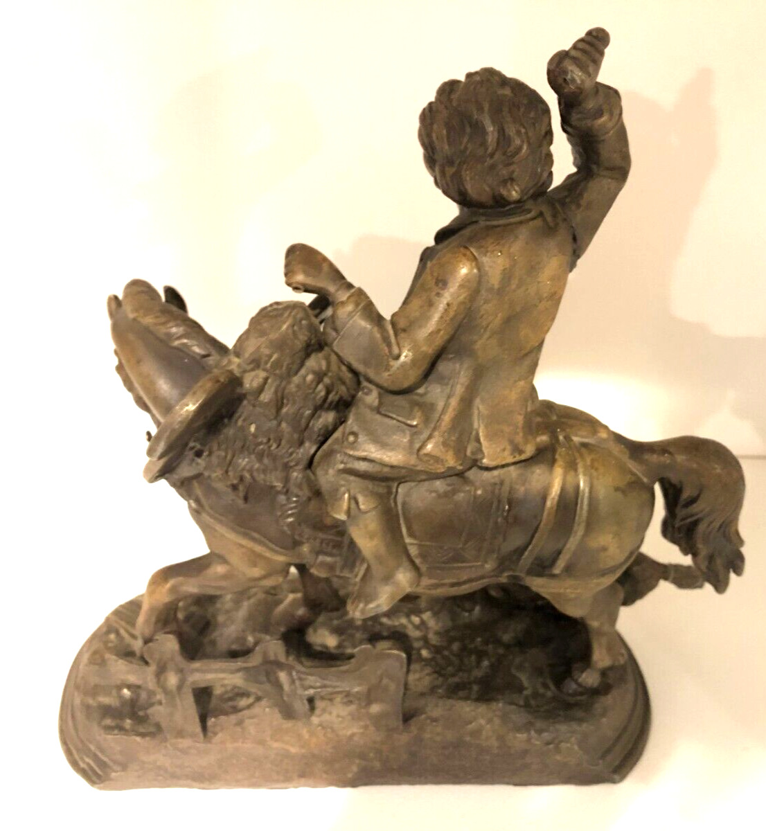 Vintage metal sculpture of Boy on Horse with Dog
