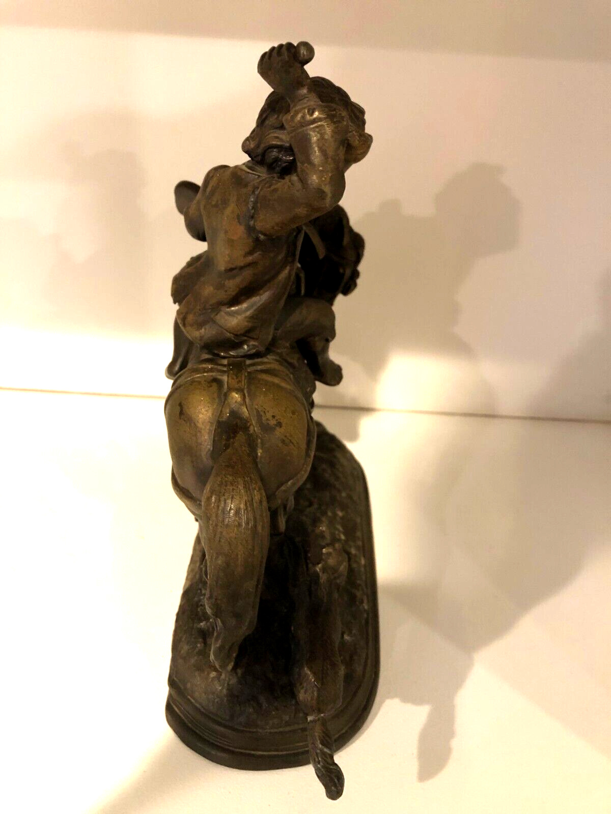 Vintage metal sculpture of Boy on Horse with Dog
