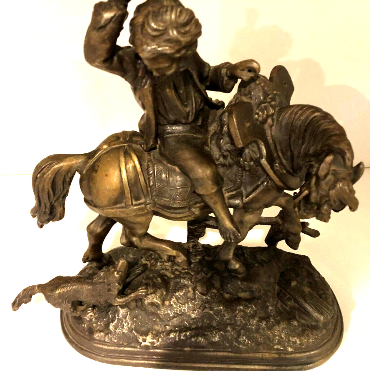Vintage metal sculpture of Boy on Horse with Dog