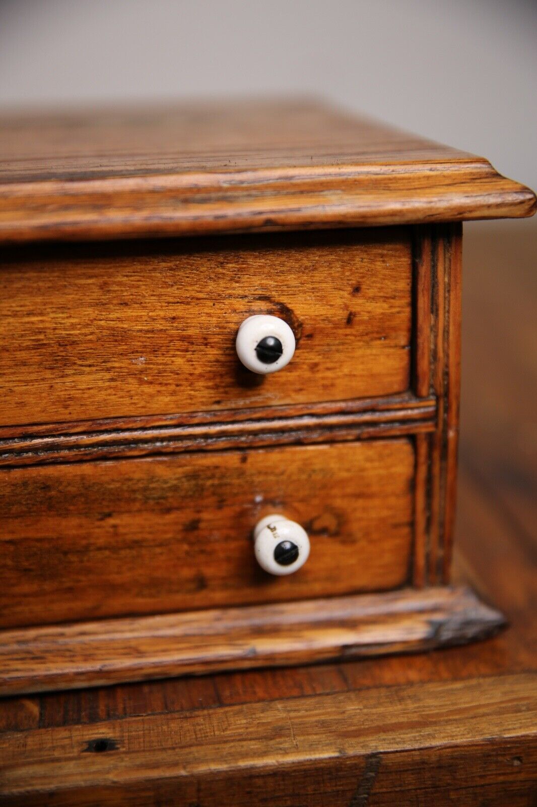 Antique apothecary drawer with porcelain knobs