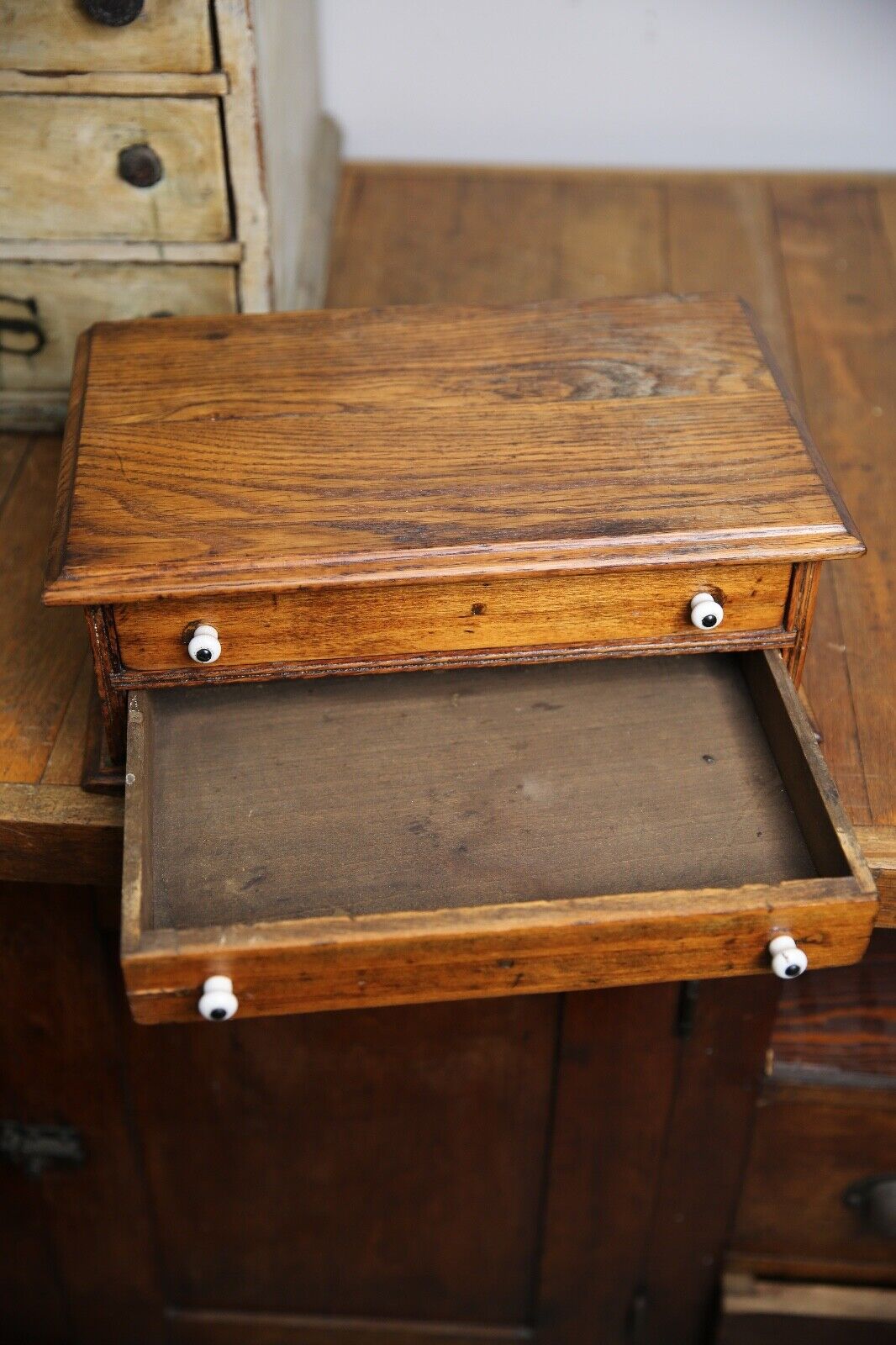 Antique apothecary drawer with porcelain knobs