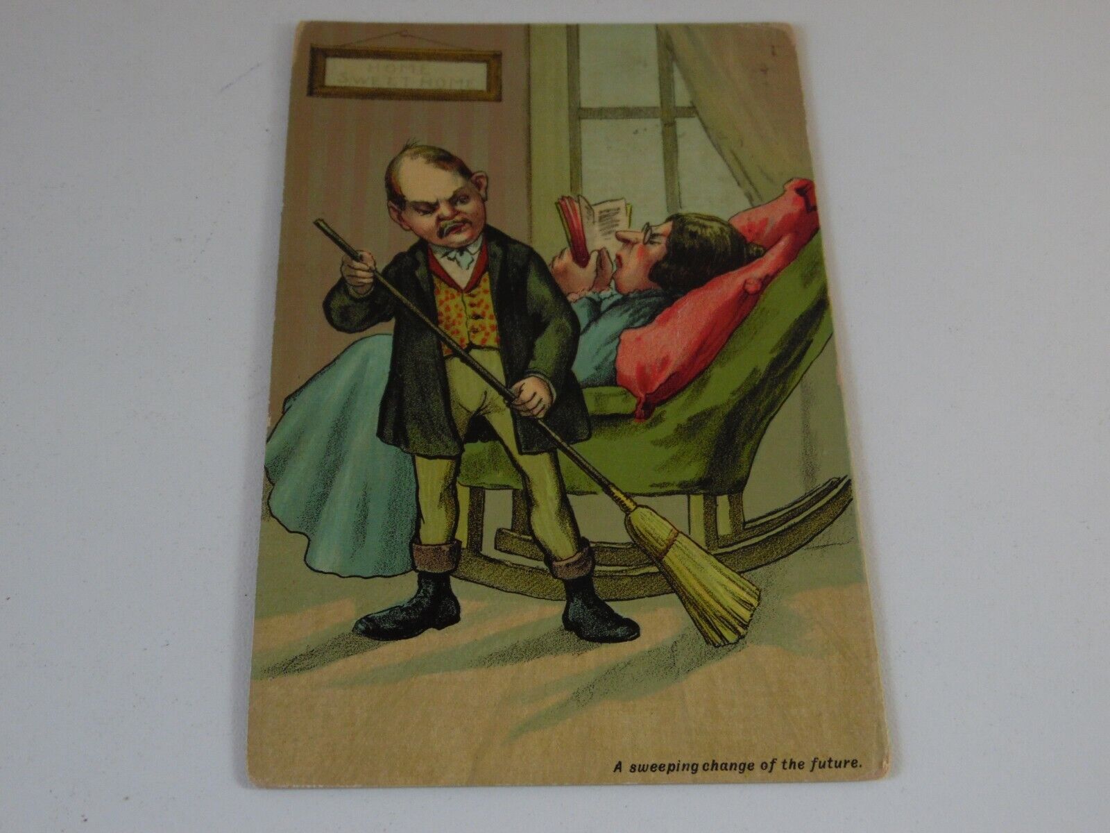1900-1910 Antique Postcard with Man Sweeping Woman from Chair