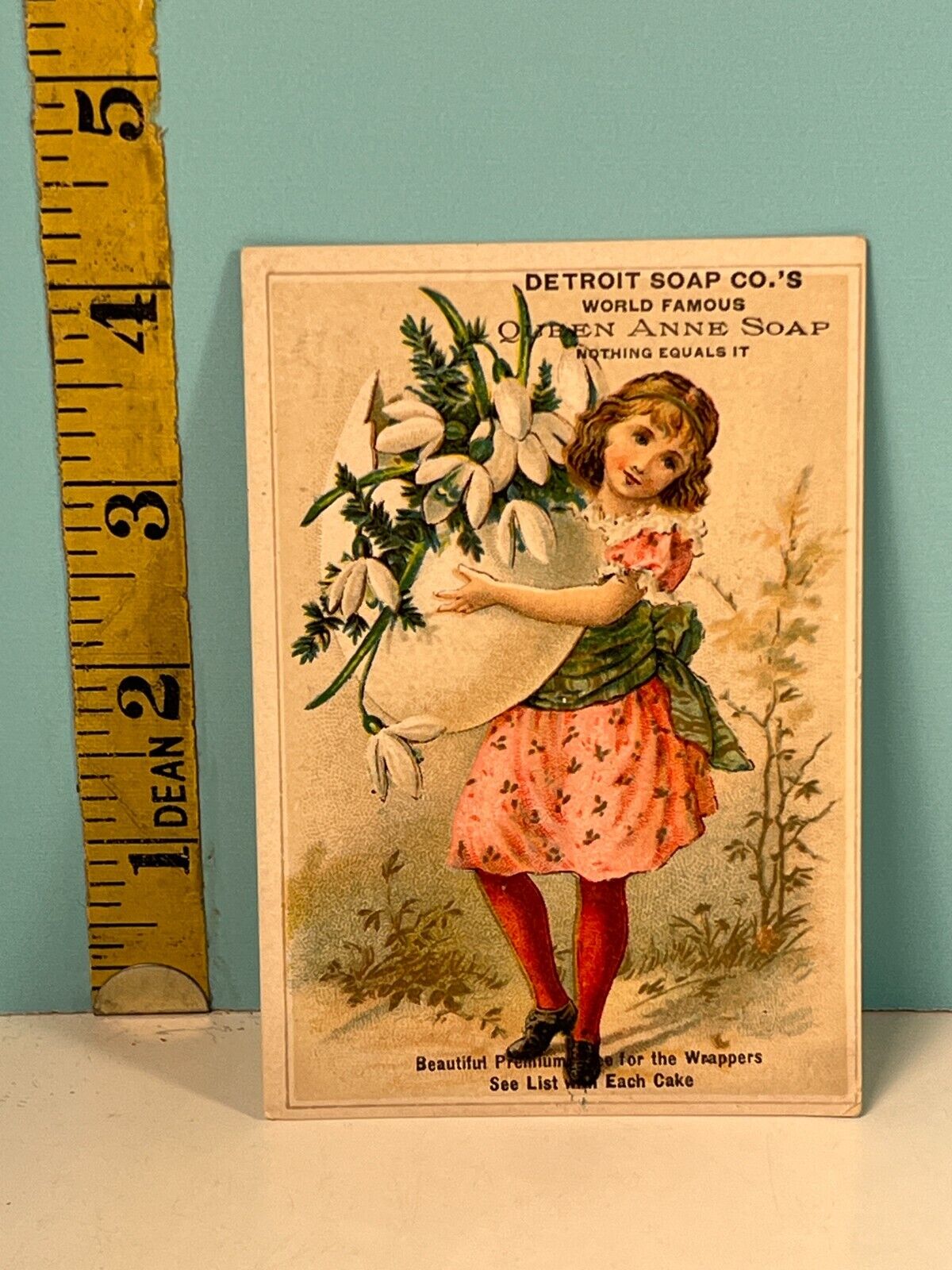 1800's Queen Anne Detroit Soap Co, Girl holding Bouquet of flowers trade card.