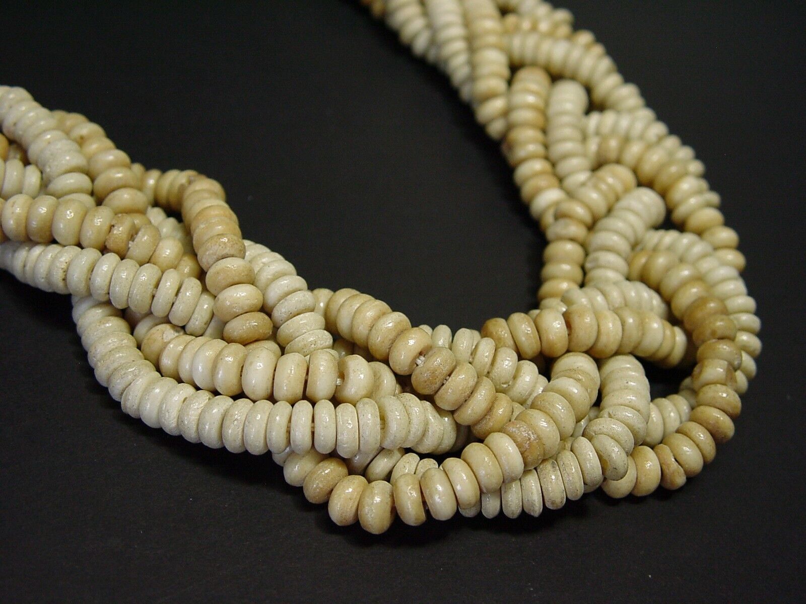 VINTAGE CARVED TWISTED STRAND BEADED STATEMENT NECKLACE. Late 1800s-1900s