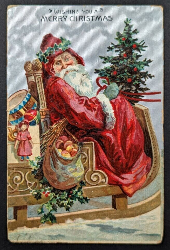 Santa Claus in Sled with Apples~Toys~Drum~Antique~German~Christmas Postcard~k636