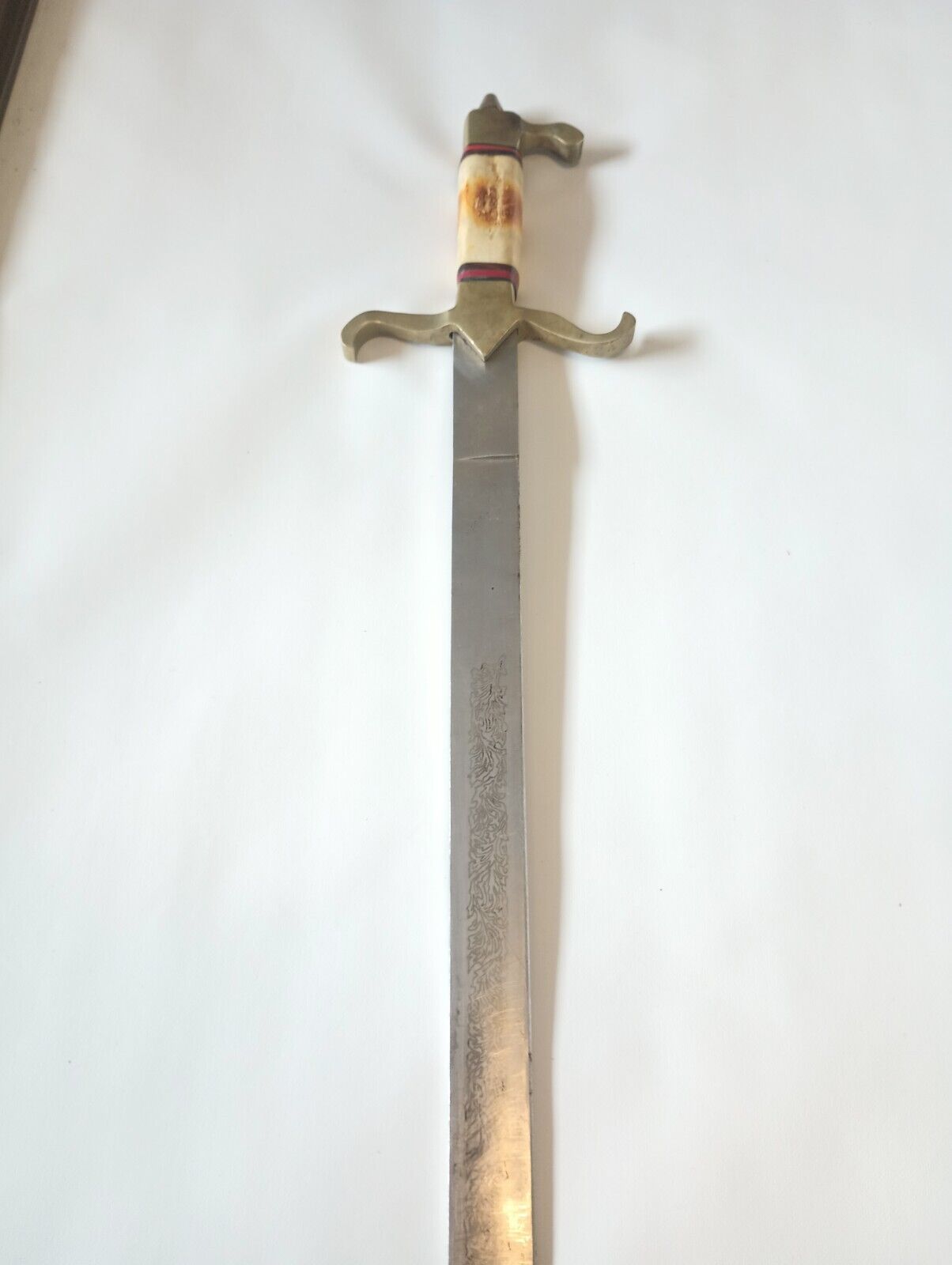 Antique Sword With Design On Blade