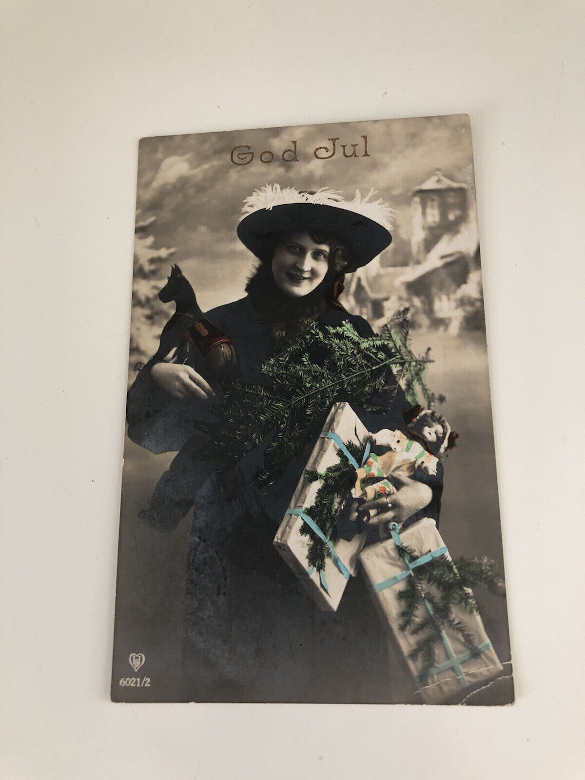 Early 1900s RPPC God Jul Woman In Fancy Hat With Toy Horse, Doll, Gifts, Painted
