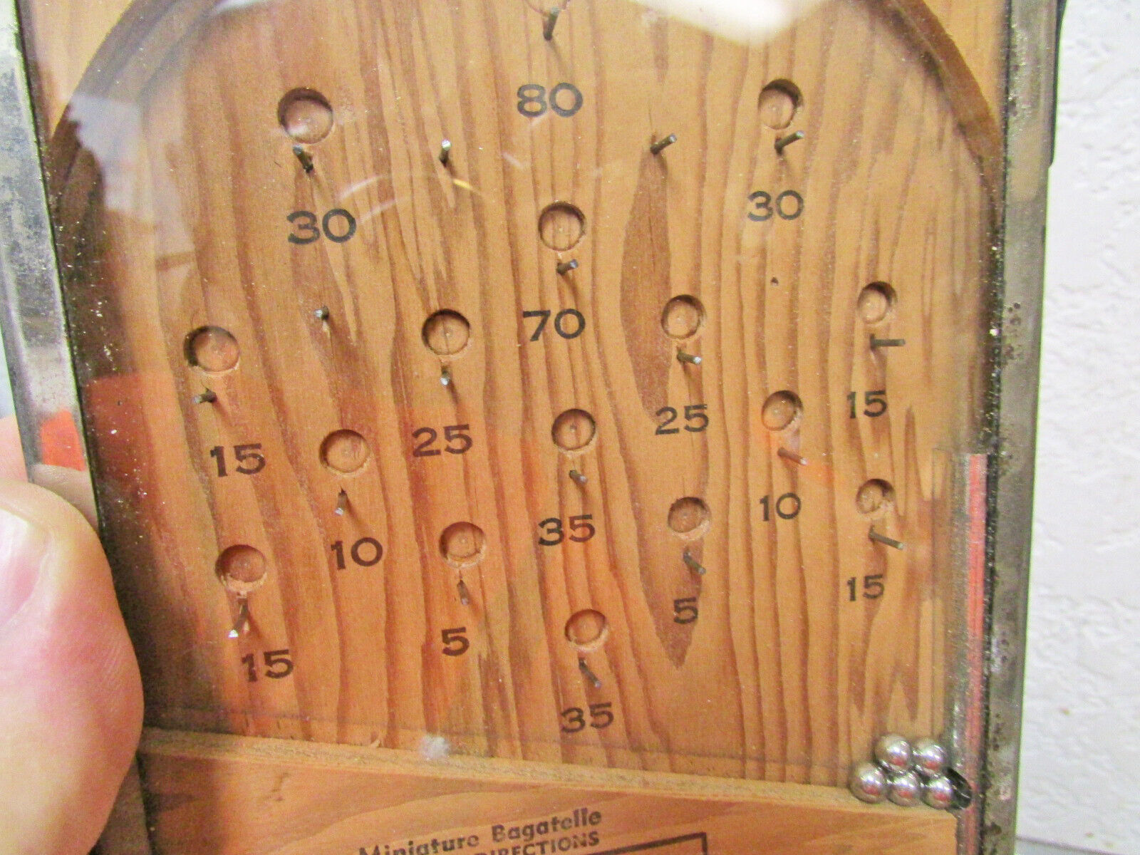 antique early 1900s Bagatelle hand held pinball game by T Cohn Brooklyn NY