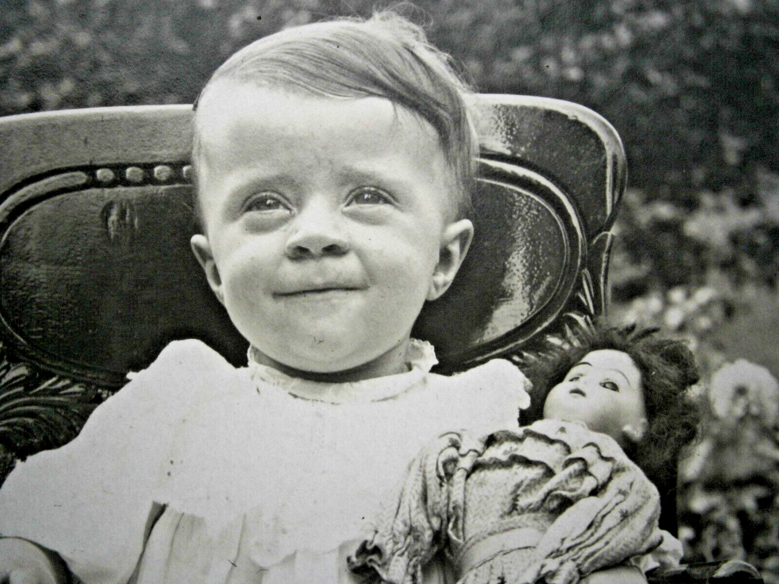 218. Real Photo Postcard of Young Girl with Her Doll from the Early 1900's