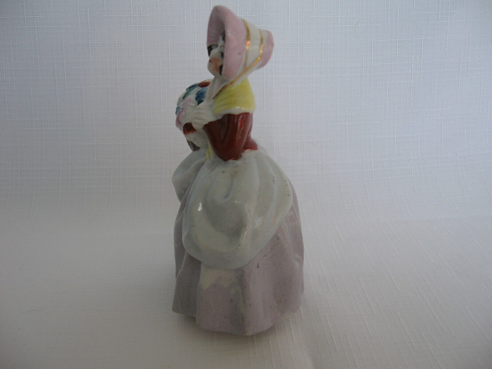 Small Made in Occupied Japan figurine 1700s woman bonnet basket flowers