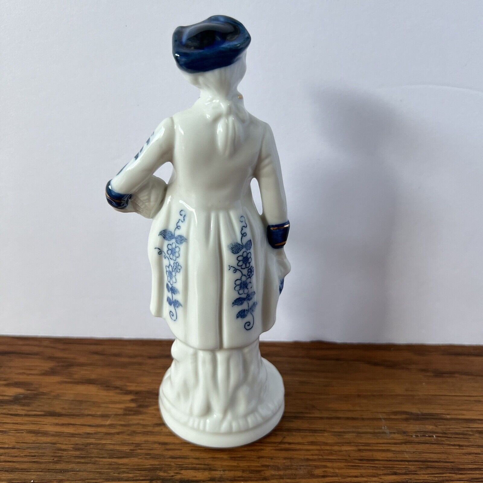 Porcelain Figure Blue and White Man with grapes, tricorne hat and 1700s garb