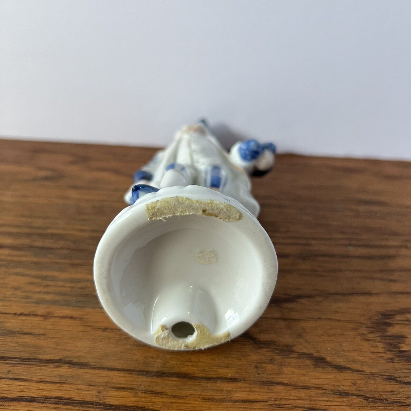 Porcelain Figure Blue and White Man with grapes, tricorne hat and 1700s garb