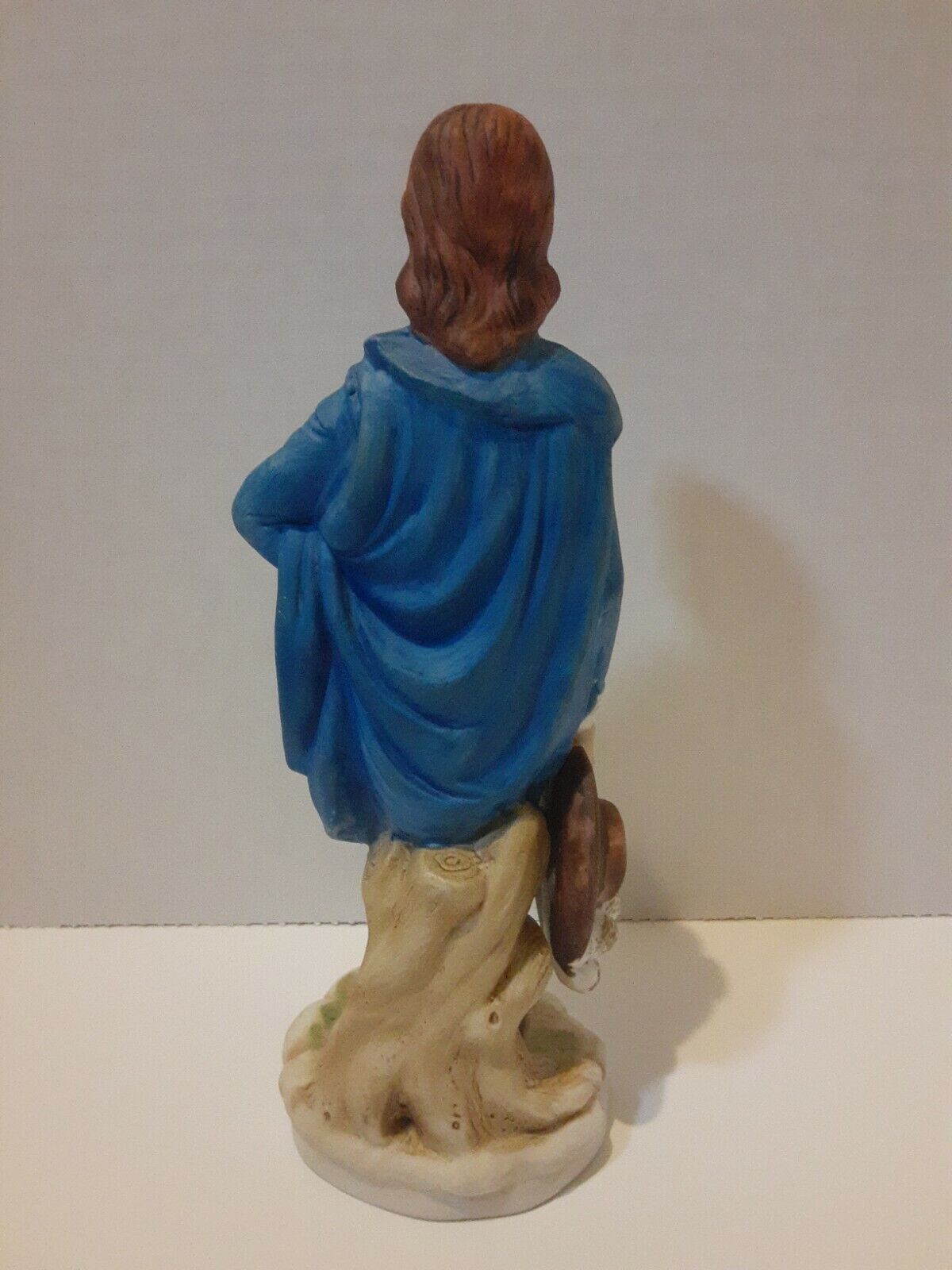 Boy In Blue Suit With Brown Hat In Hand Statue