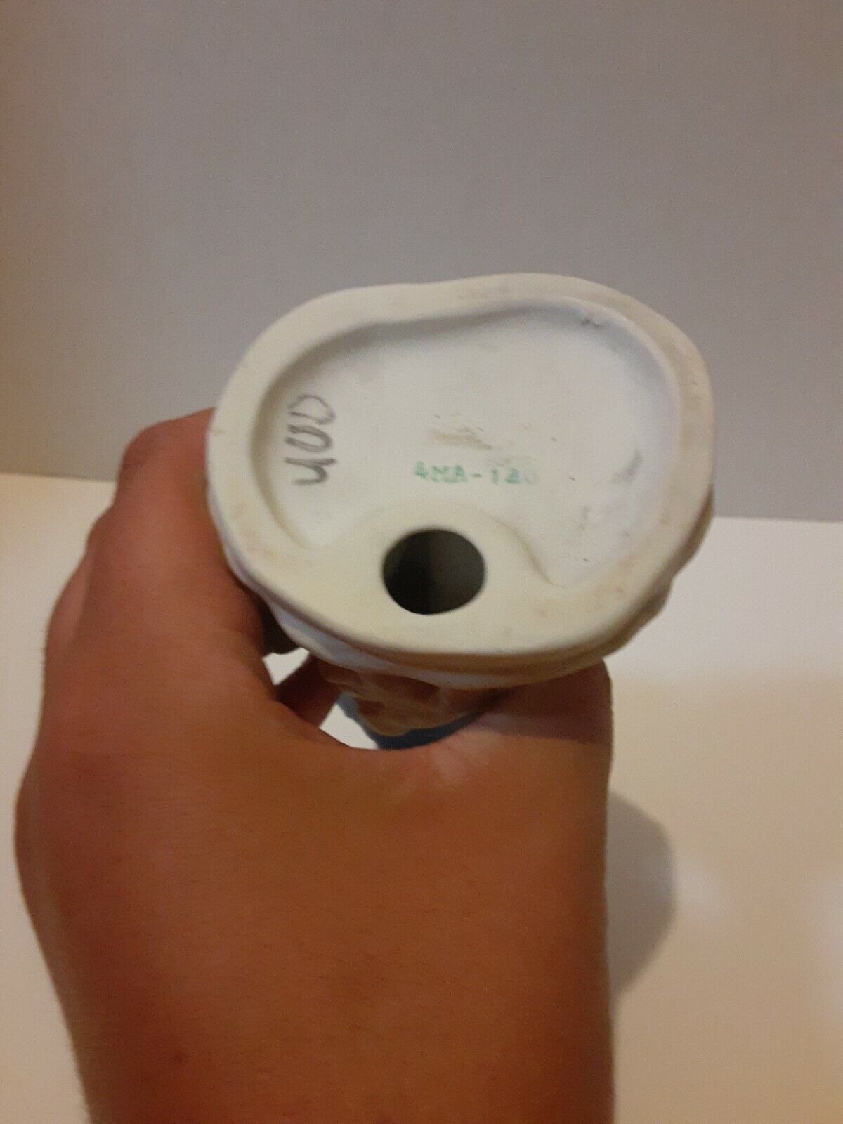 Boy In Blue Suit With Brown Hat In Hand Statue