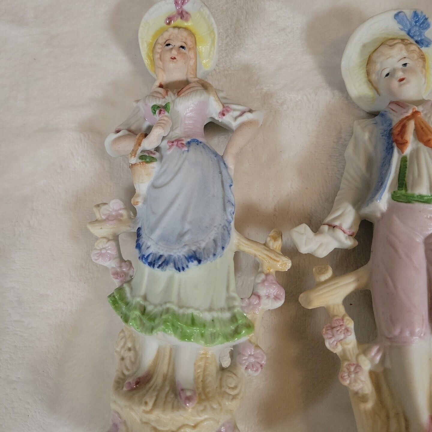2 Japanese Porcelain Statues of 17th Century Man &  Woman Resting on Fence
