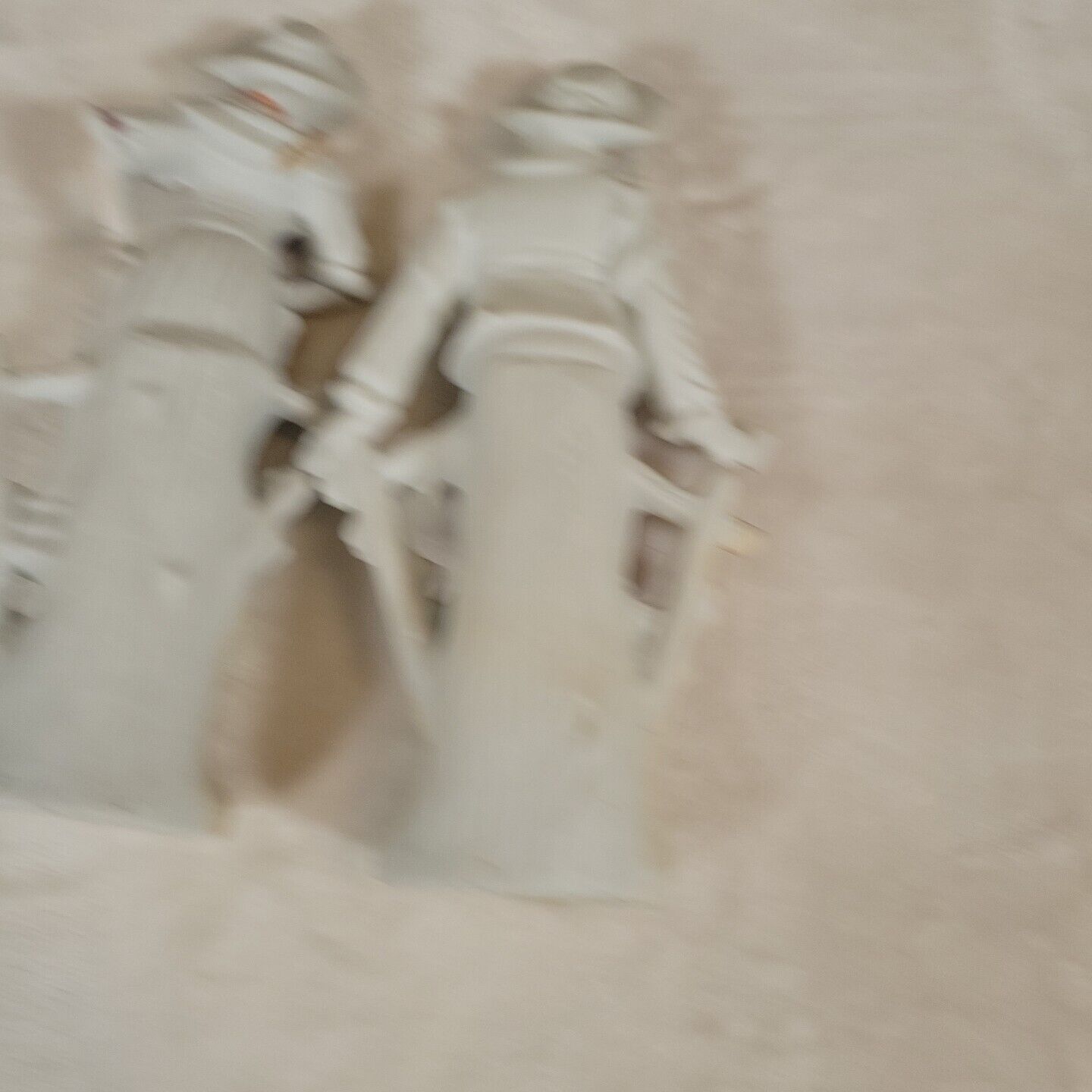 2 Japanese Porcelain Statues of 17th Century Man &  Woman Resting on Fence