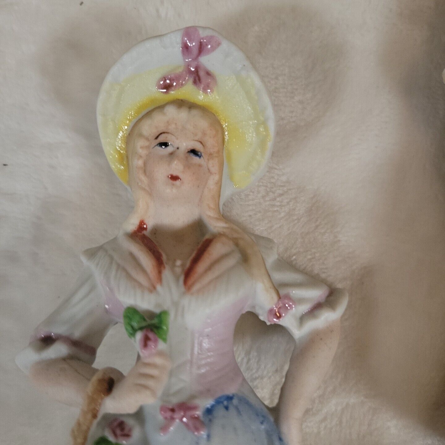 2 Japanese Porcelain Statues of 17th Century Man &  Woman Resting on Fence