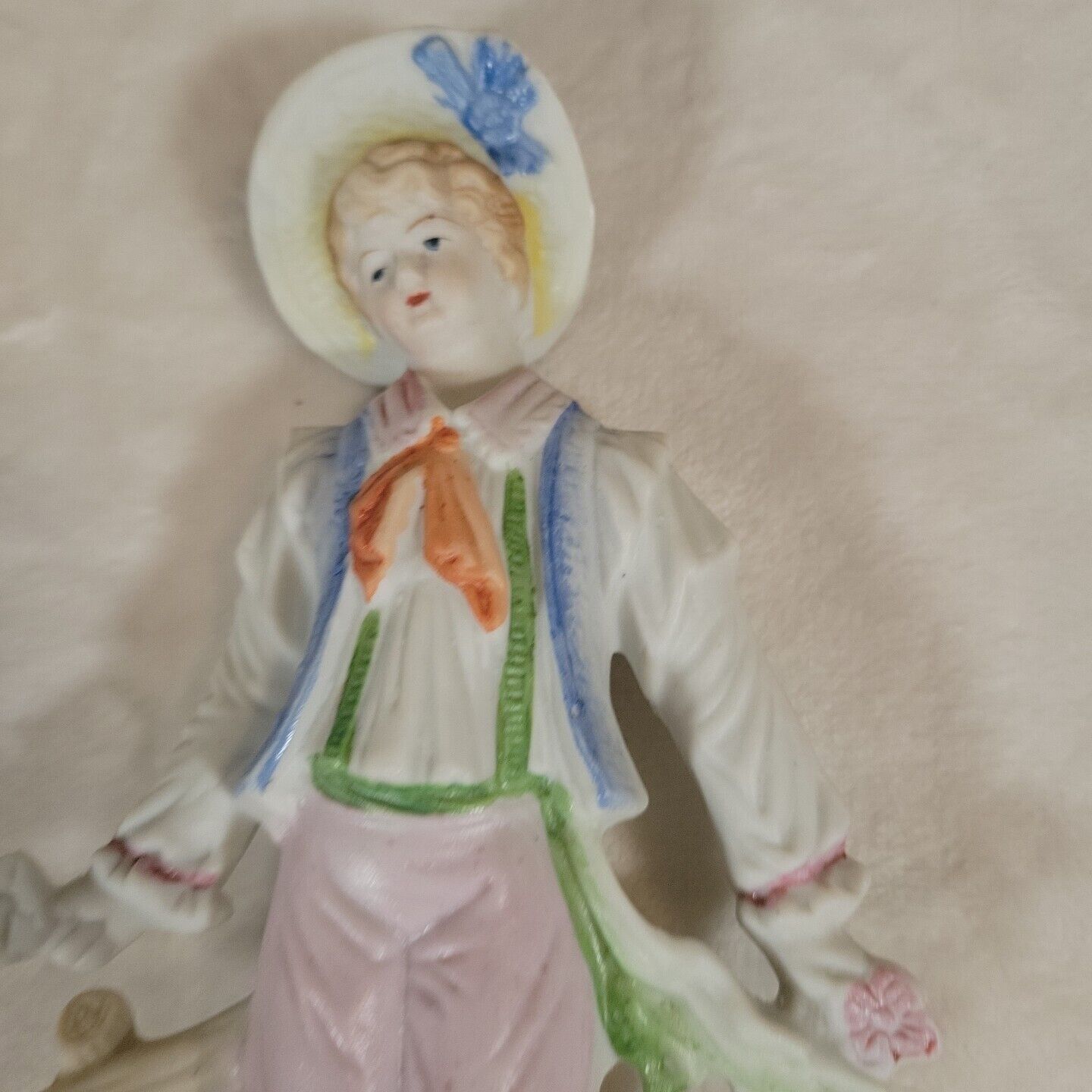 2 Japanese Porcelain Statues of 17th Century Man &  Woman Resting on Fence