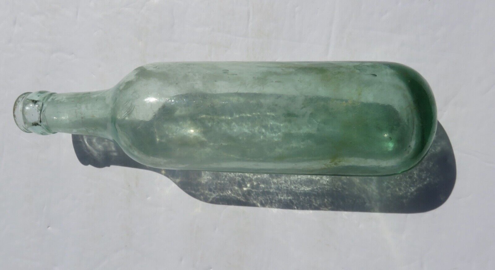 1800’s Green Glass Applied Lip 9.5” Torpedo Round Bottom Glass Bottle
