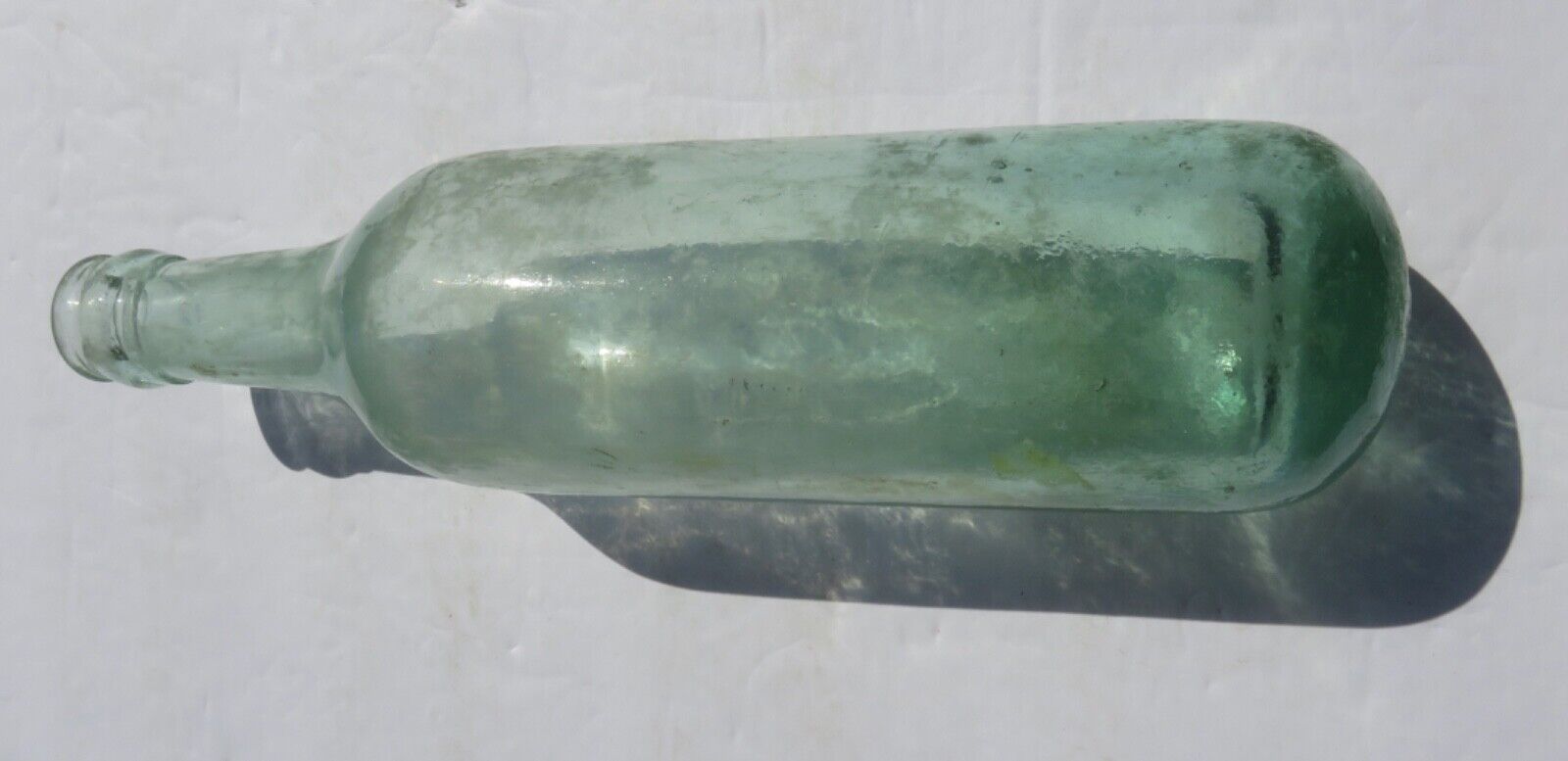 1800’s Green Glass Applied Lip 9.5” Torpedo Round Bottom Glass Bottle