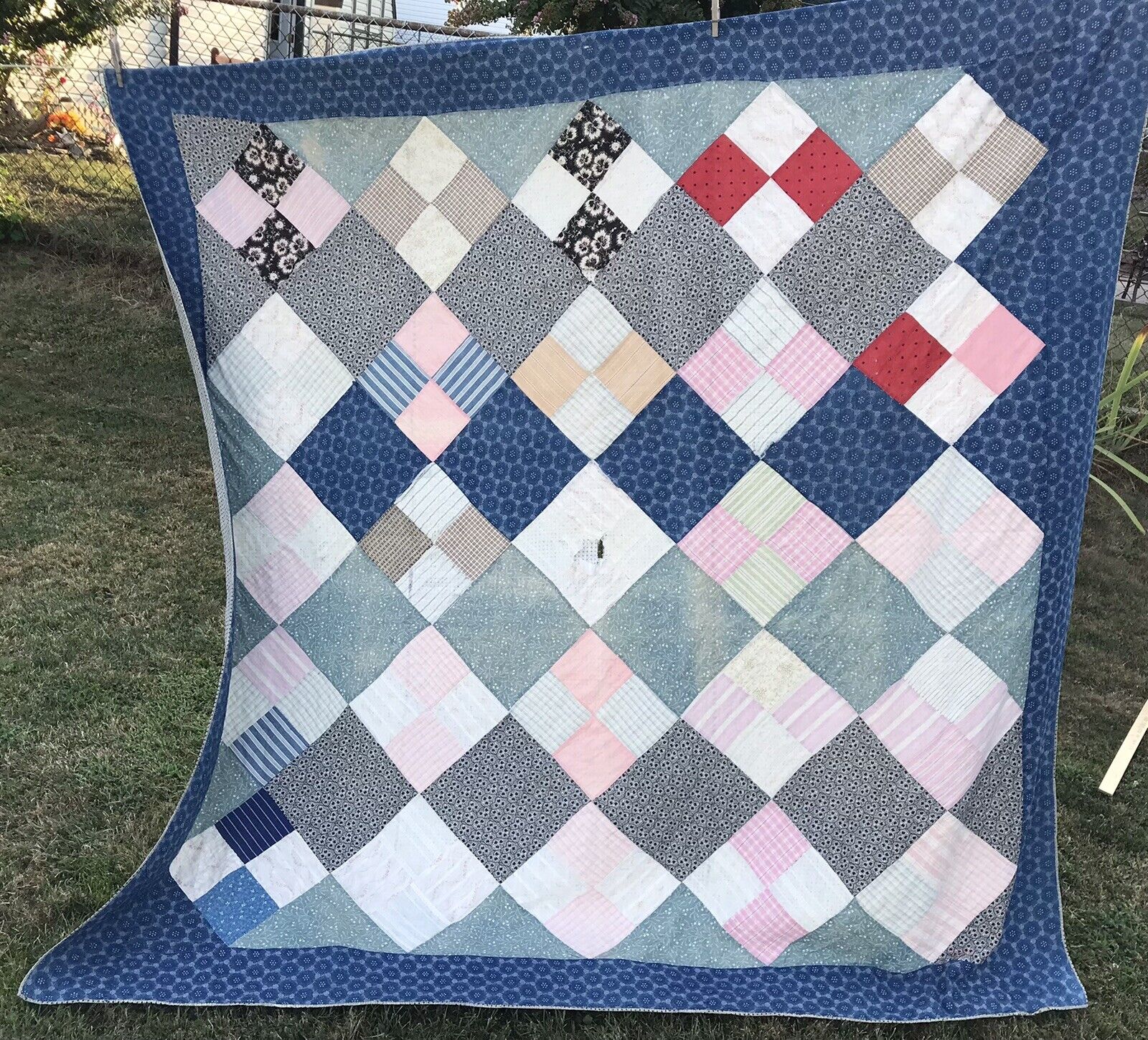 Vintage Hand-Stitched Feedsack Quilt from 1900s