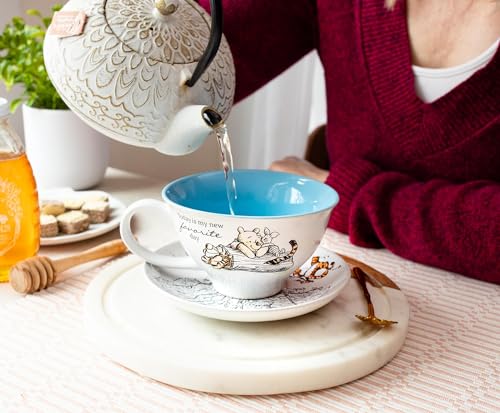 Silver Buffalo Disney Winnie the Pooh Walking Classic Scene Ceramic Teacup and Saucer, 12 Ounces