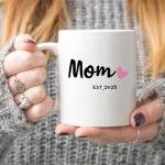 MAUAG Mom Est 2025 Coffee Mug, Mother's Day New Mom Gifts for Women Her, First Time Moms Cup, White 11 Oz