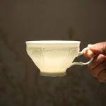 Elegant White Porcelain Teacup and Saucer Set