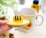 Silver Buffalo Disney Winnie the Pooh Eating Honey Ceramic Mug with Sculpted 3D Bee Lid, 18 Ounces