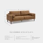 Signature Design by Ashley Telora Faux Leather Sofa, 2 Bolster Pillows, Loose Cushions, Faux Wood Finish Accent Legs, 85" W x 35" D x 35" H, Dark Brown