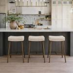 Maven Lane Berkley Backless Counter Stool 26 Inch – Saddle Stool with Footrest – Aged Gold Metal Frame & Beige Fabric Upholstery – Perfect for Kitchen Island & Counters