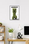 A Minecraft Movie - Creeper Feature Series Wall Poster, 22.4L" x 14.7W", Gray Framed Version