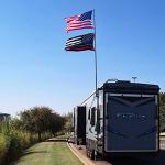 The Traveler Two Flag RV Ladder Flag Pole Kit. Includes Two Beautiful 3’x5’ Flags, Steel RV Flag pole Mount, Fits Standard 1” RV Ladders,14ft Fiberglass Retractable Pole, And A Storage Bag.
