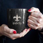 Rico Industries NFL Football New Orleans Saints Primary 16 oz Team Color Laser Engraved Ceramic Coffee Mug